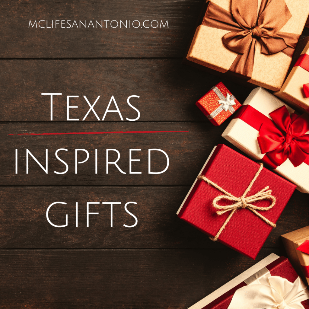 Red and white boxed presents on a wood table. Text reads "Texas Inspired Gifts. mclifesanantonio.com"